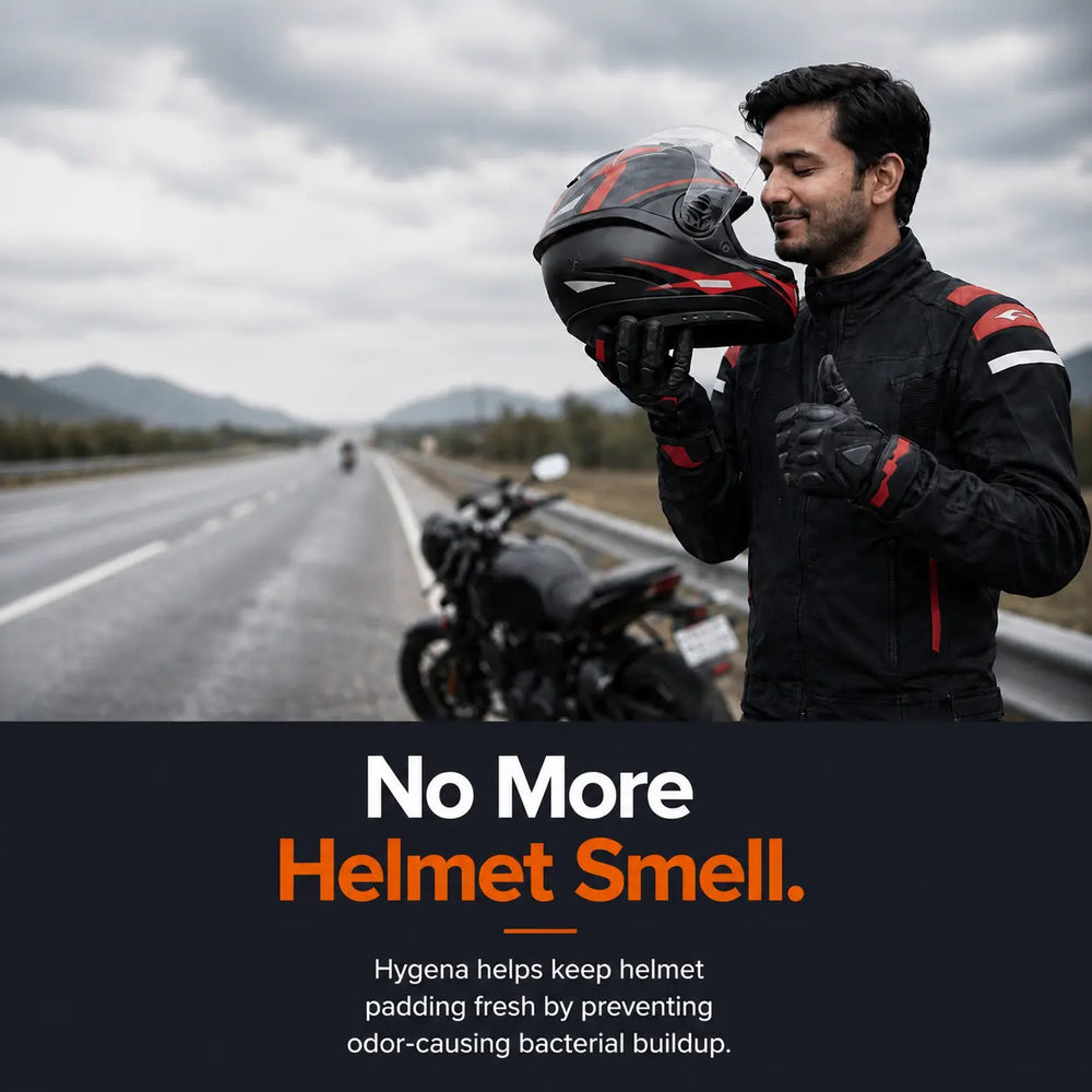 Man holding a helmet with a motorcycle on a road, promoting Hygena helmet cleaning product.